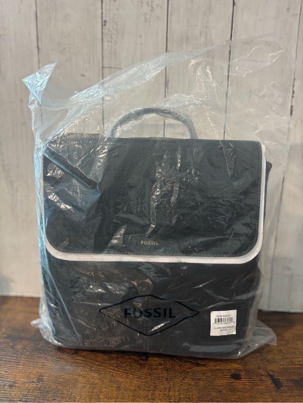 Fossil Black Backpack with Brown Button and Straps
